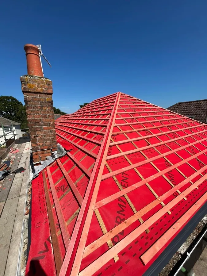 A KNJ Roofing re-roofing project underway, with battens and breathable membrane fitted around the chimney