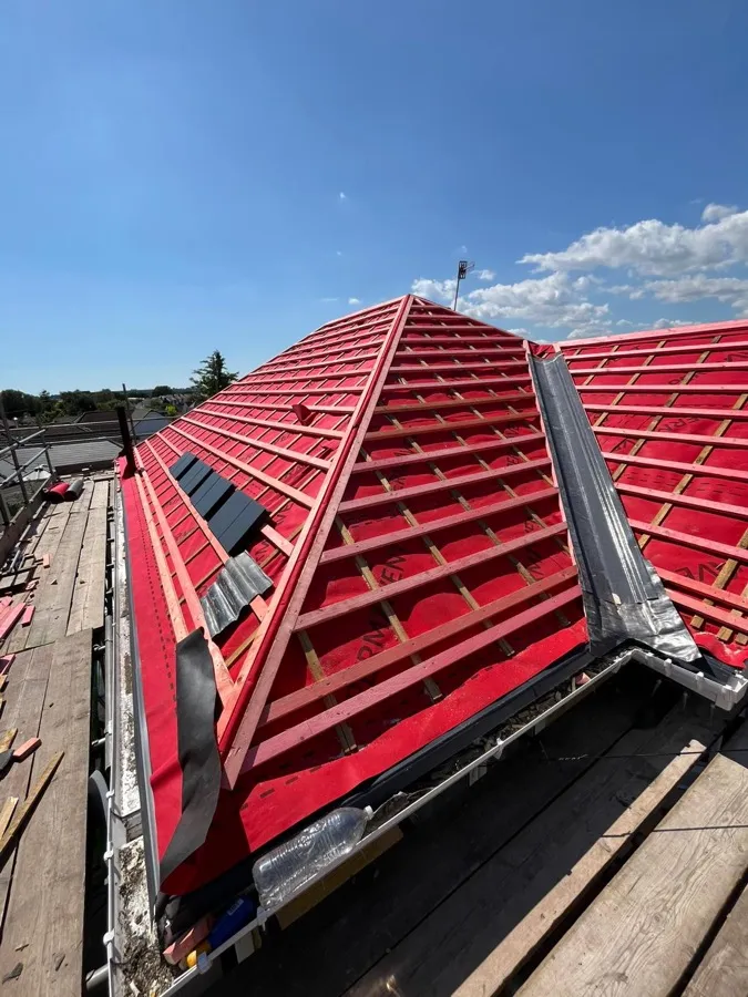 New tiles and lead valley work completed at the roof eaves